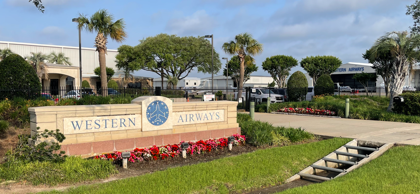 Morning view of the well-manicured entrance to Western Airways